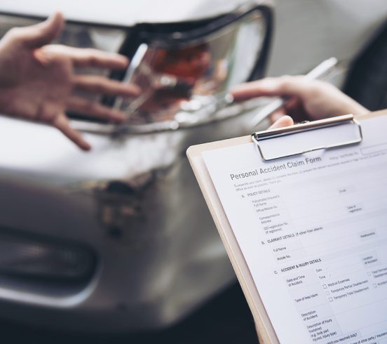 Insurance agent working during on site car accident claim process - people and car insurance claim concept